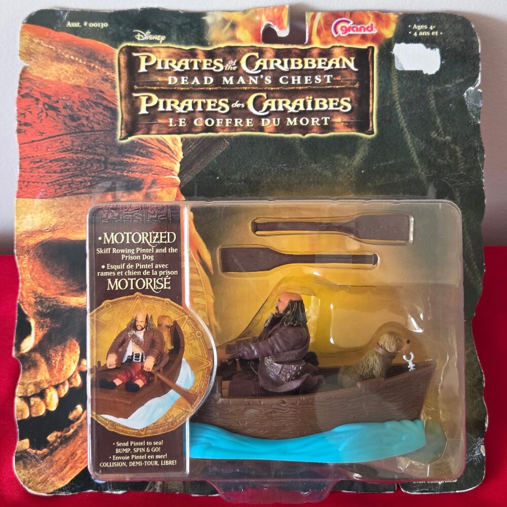 2006 PIRATES OF THE CARIBBEAN, MOTORIZED SKIFF WITH PINTEL & THE PRISON DOG!!!